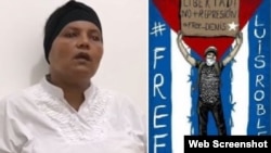 Yindra Elizástigui junto a un cartel por la libertad de su hijo, Luis Robles Elizástigui, confinado en el Combinado del Este, La Habana.